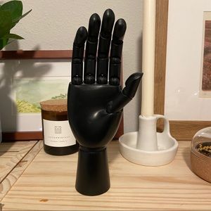 Black flexible wooden hand
